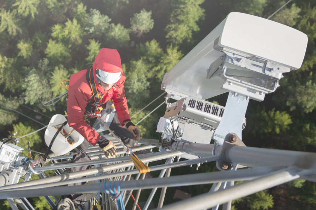 Engineer climbing a telecoms mast - Coleago Consulting transaction services